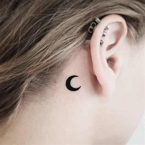 small crescent moon tattoo|moon crescent tattoo behind ear.